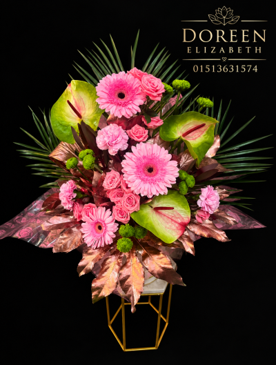 floral fantasies - This arrangement is low maintenance as it is designed into a box with floral foam that provides a water source . It is made with fresh flowers, dried flowers and foliage.