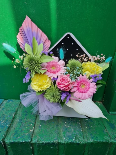 perfect pastels - This envalope design is made in floral foam, and a mixture of fresh flowers have been used, these pastel flowers are perfect for any occasion.