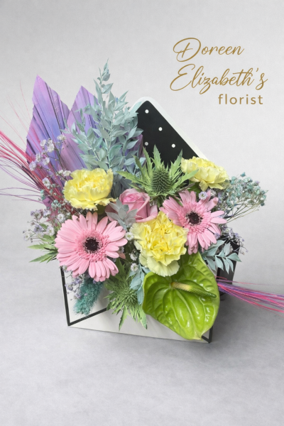 perfect pastels - This envelope design is made in floral foam, and a mixture of fresh flowers have been used, these pastel flowers are perfect for any occasion.