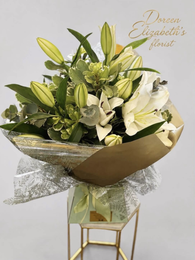 Forever Yours - Show your affection with this fabulous hand-tied  featuring white oriental lilies and foliage.