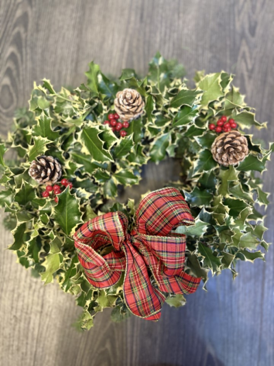 tartan bowed fresh wreath - fresh wreath made on moss frame with spruce, holly, pine cones and artificial berries. finished with a beautiful tartan bow