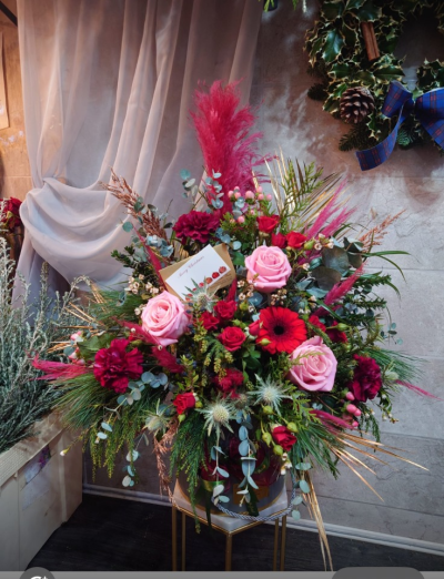 luxury christmas hat box - an amazing arrangement of seasonal flowers and foliage including pampas grass, roses, Eringium, gold solidago and dianthus.