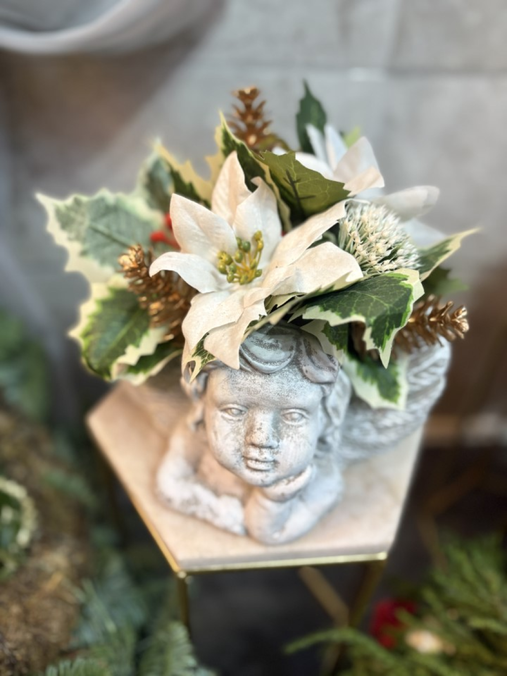 white ornamental cherub planter