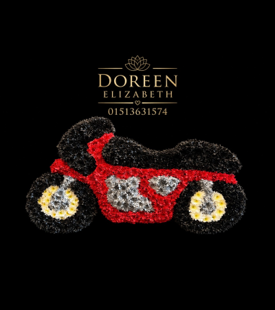 Motor bike memorial flowers - A motorbike design made from massed crysanthemums added to an floral foam base to maintain freshness